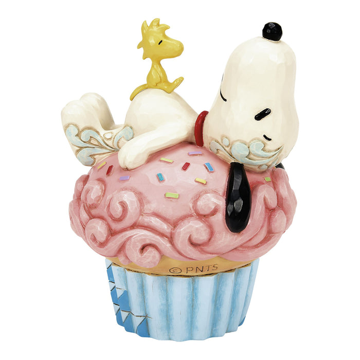 Snoopy Laying on Cupcake