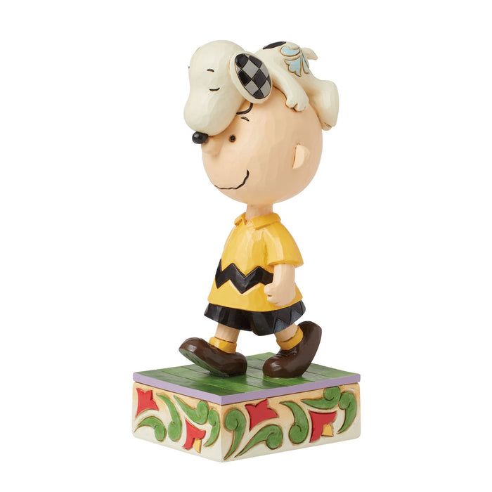 Snoopy on Charlie Brown's Head