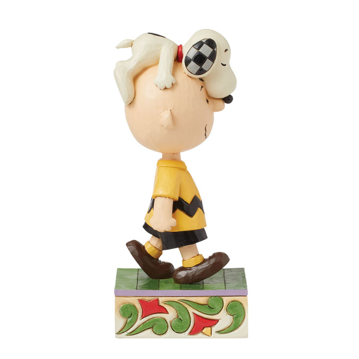 Snoopy on Charlie Brown's Head